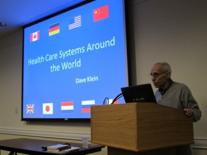 Dr. David Klein speaks on health care systems around the world. Photo: Joe Mengel