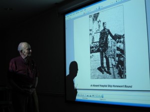 Carolina Meadows resident Lovick Miller discusses his time as a POW during a presentation in the Fairways Gallery.